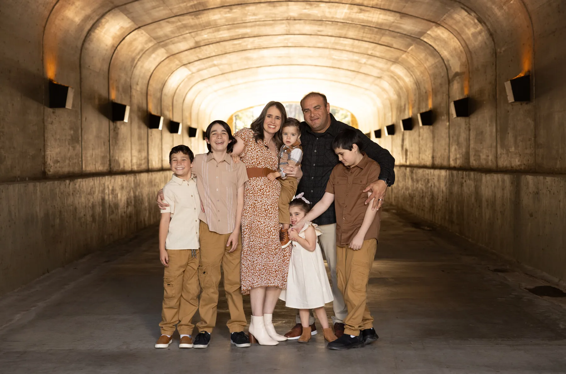 Rod and his wife with their five children under the arched underpass at Lago Santa Margarita.